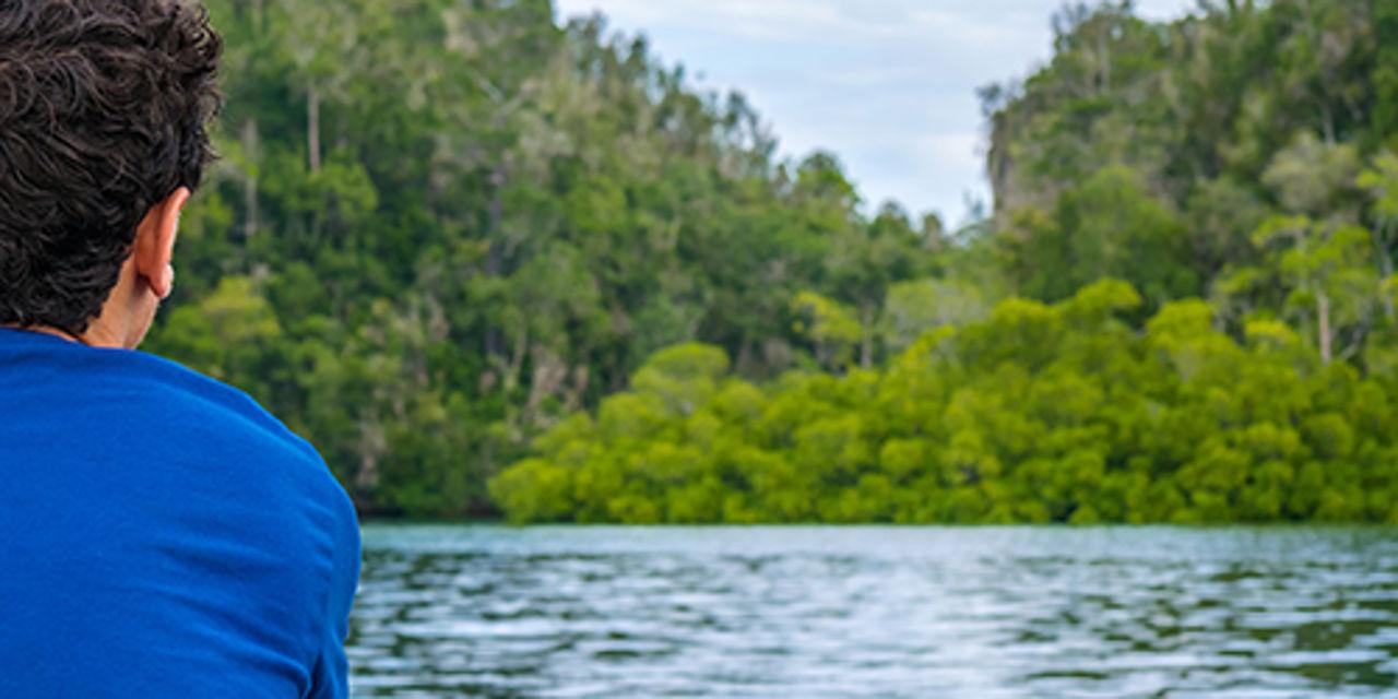 Man sitting at a lake